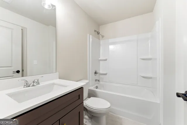 a bathroom with a sink a toilet and a bathtub