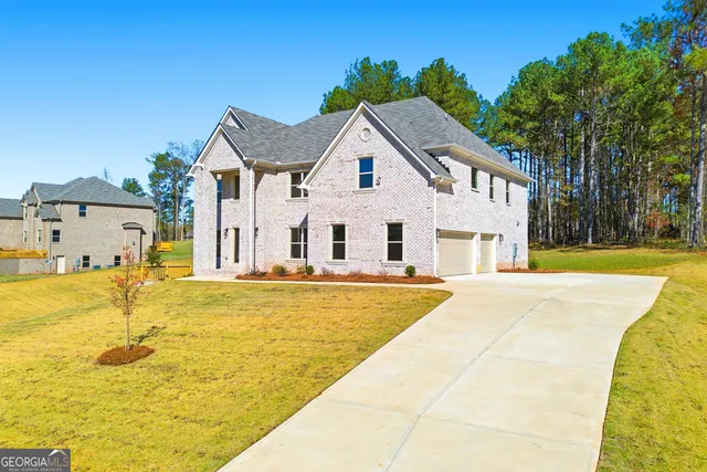 a view of entryway with stairs and wooden floor