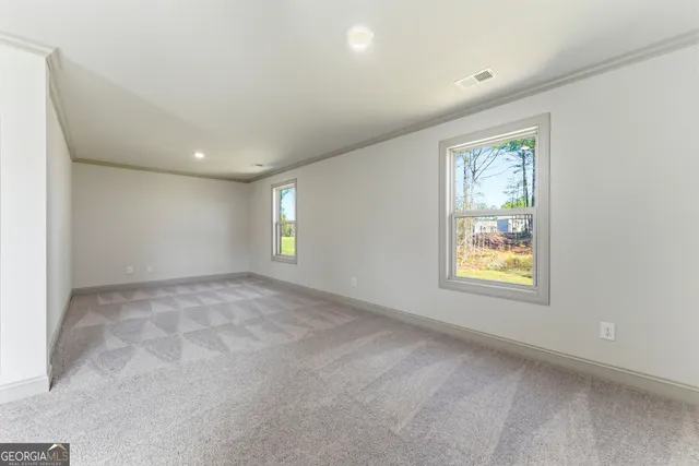 an empty room with windows and closet