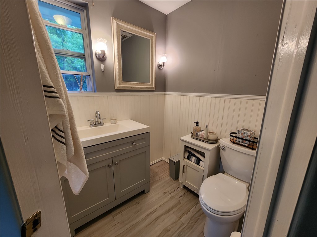 86007 Jones Road Yulee, FL 32097 - Photo 3 of 12 a bathroom with a granite countertop toilet sink and mirror
