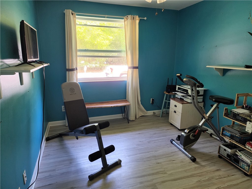 86007 Jones Road Yulee, FL 32097 - Photo 6 of 12 a view of a workspace with furniture and a window
