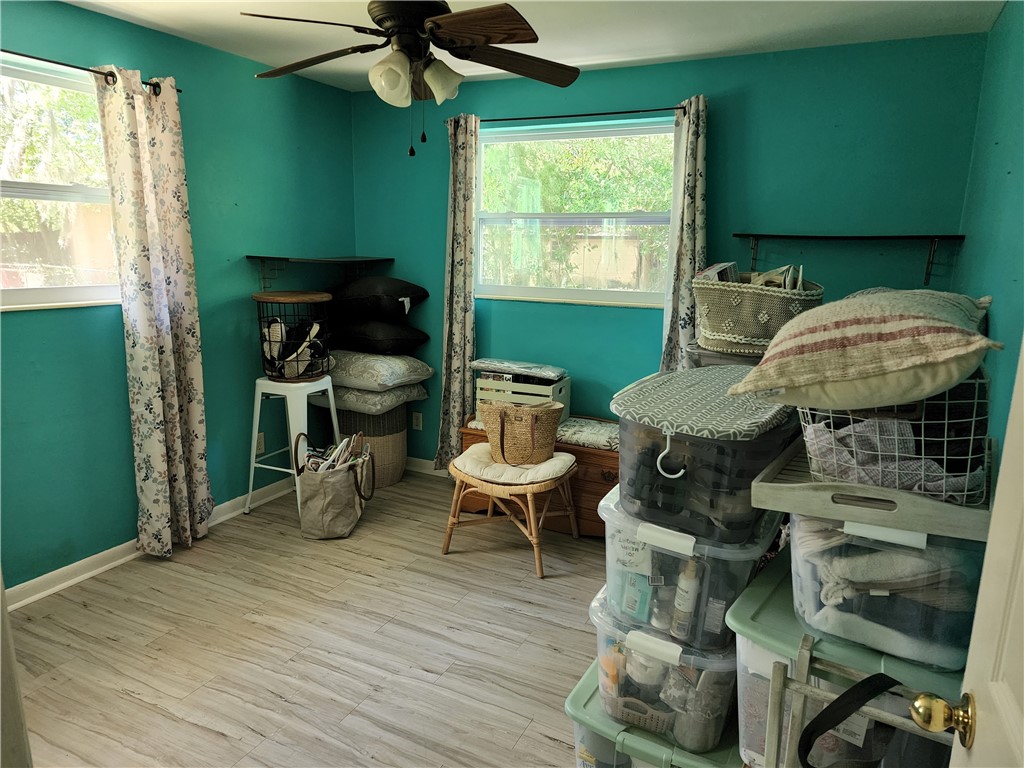 86007 Jones Road Yulee, FL 32097 - Photo 7 of 12 a living room with furniture a window and a fireplace