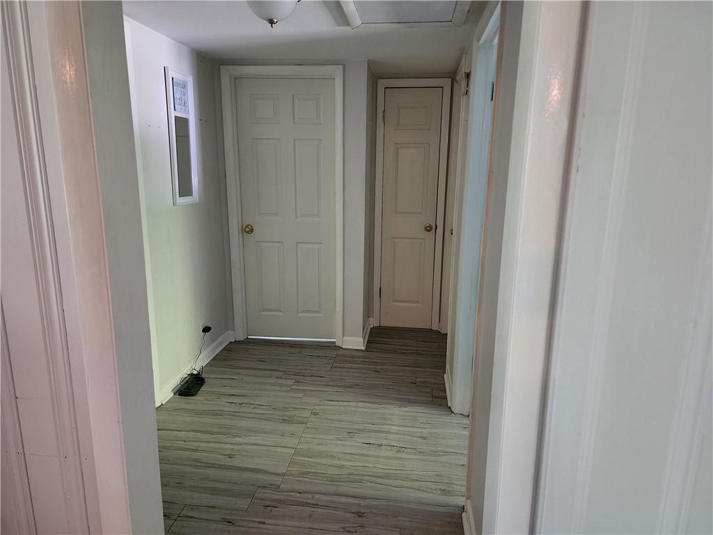 86007 Jones Road Yulee, FL 32097 - Photo 9 of 12 a view of a hallway with wooden floor