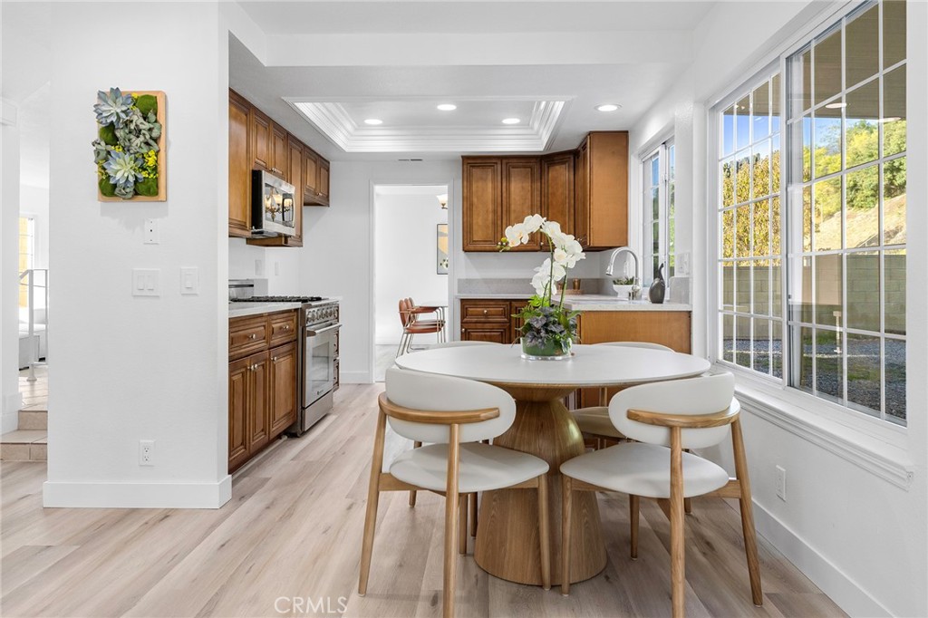 550 Great Bend Drive Diamond Bar, CA 91765 - Photo 13 of 41 a view of a dining room with furniture a chandelier and wooden floor