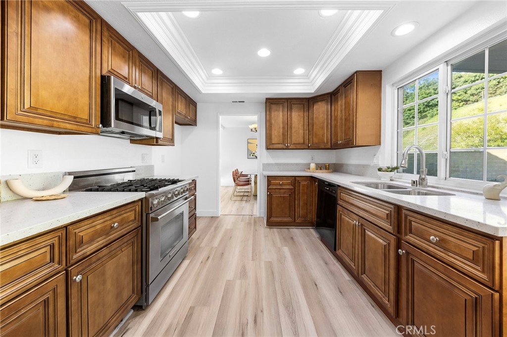 550 Great Bend Drive Diamond Bar, CA 91765 - Photo 14 of 41 a kitchen with stainless steel appliances granite countertop wooden cabinets a sink and a stove