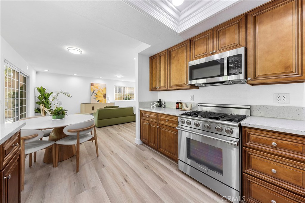550 Great Bend Drive Diamond Bar, CA 91765 - Photo 15 of 41 a kitchen with stainless steel appliances a stove microwave and cabinets