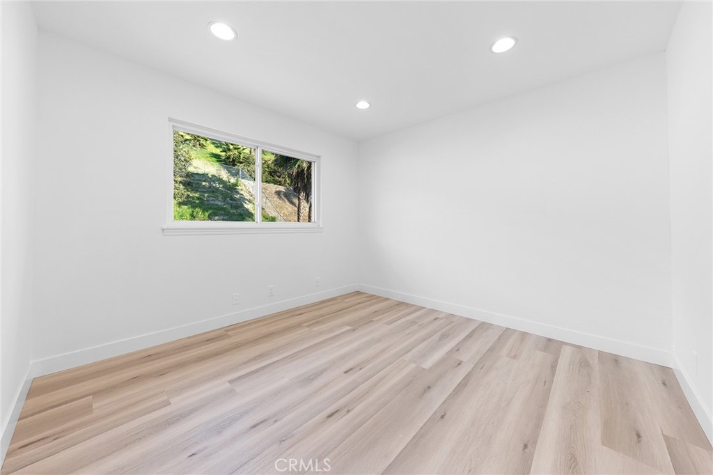 550 Great Bend Drive Diamond Bar, CA 91765 - Photo 23 of 41 an empty room with wooden floor and windows