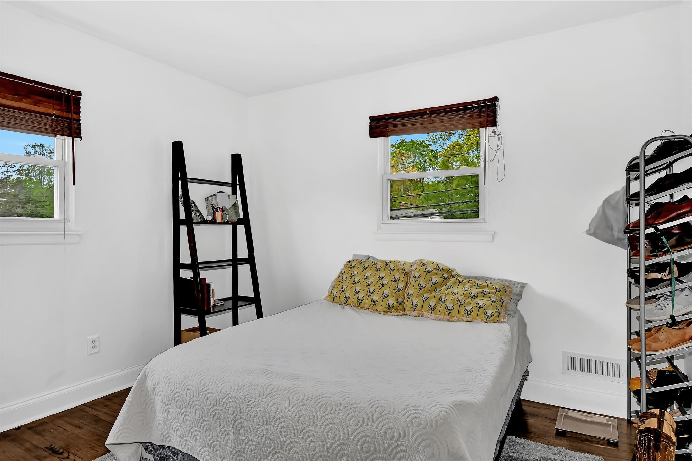 675 Harmony Road Middletown, NJ 07748 - Photo 12 of 25 a bedroom with a bed and a window