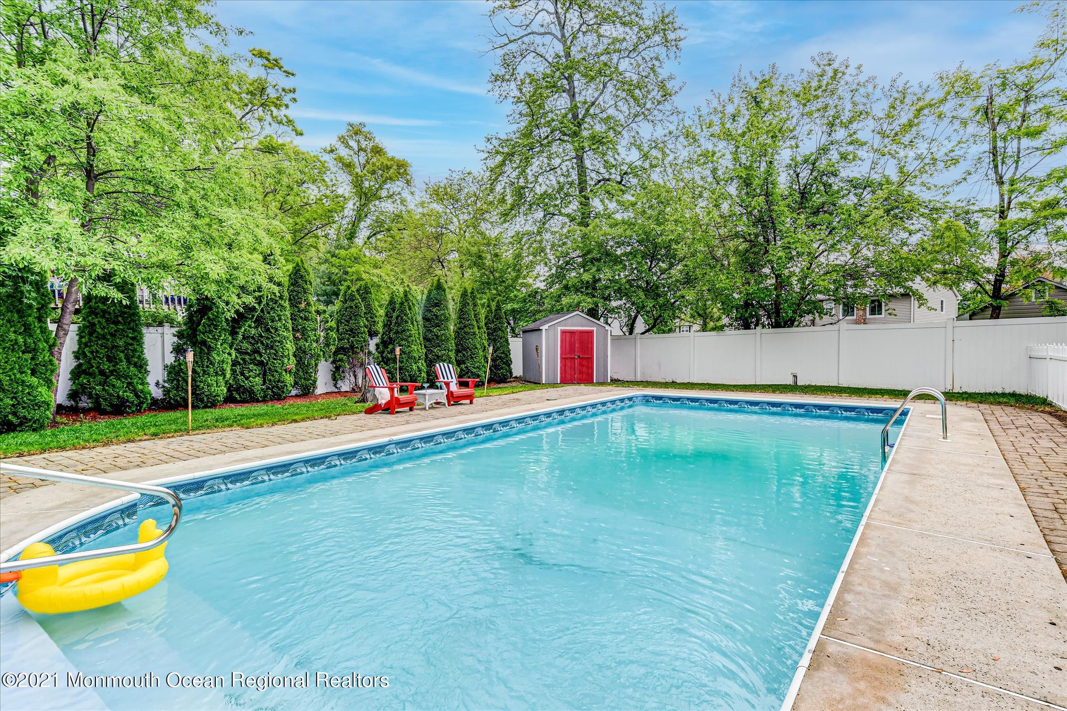 675 Harmony Road Middletown, NJ 07748 - Photo 17 of 25 a view of swimming pool with chairs