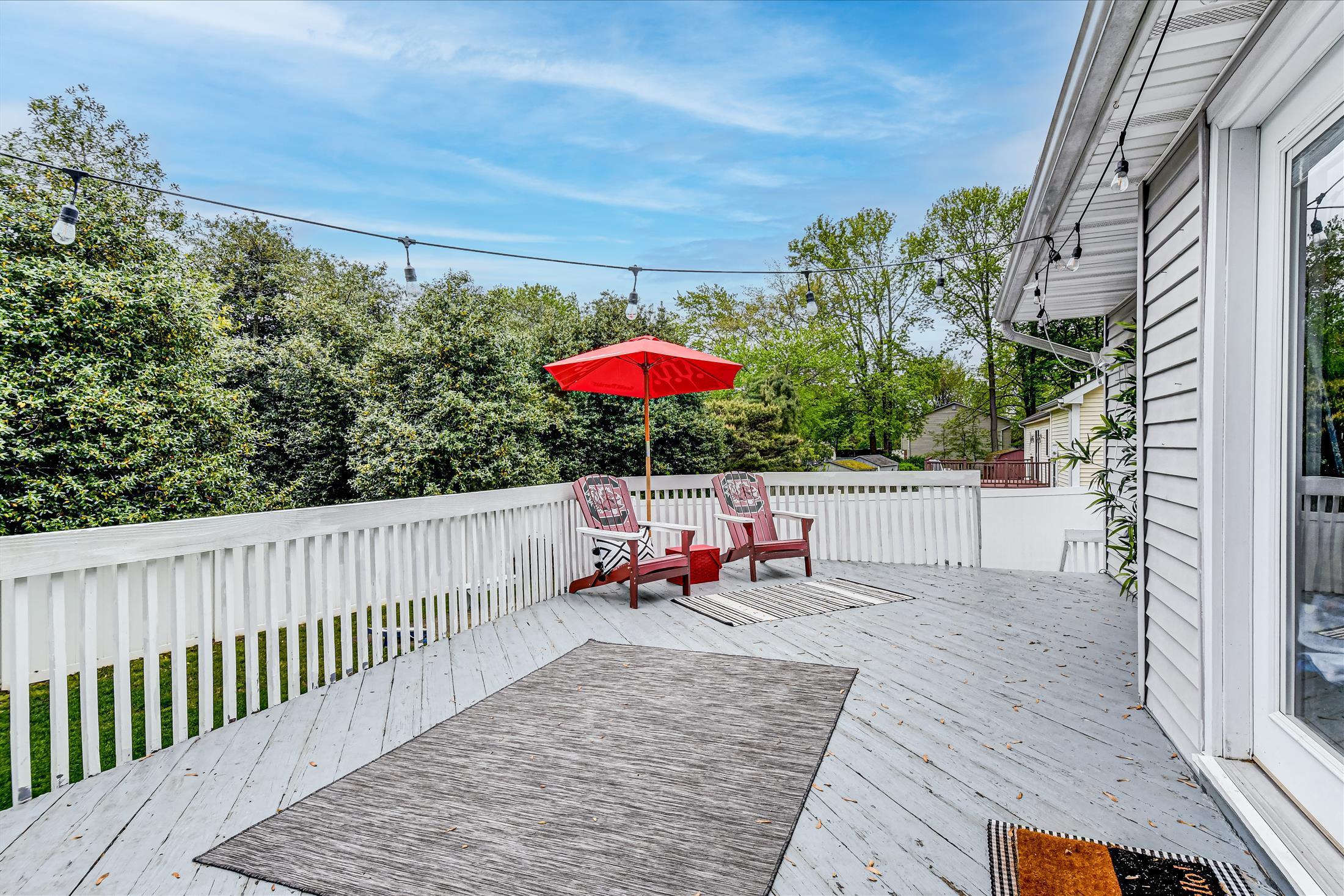 675 Harmony Road Middletown, NJ 07748 - Photo 19 of 25 an outdoor sitting area with furniture and wooden deck