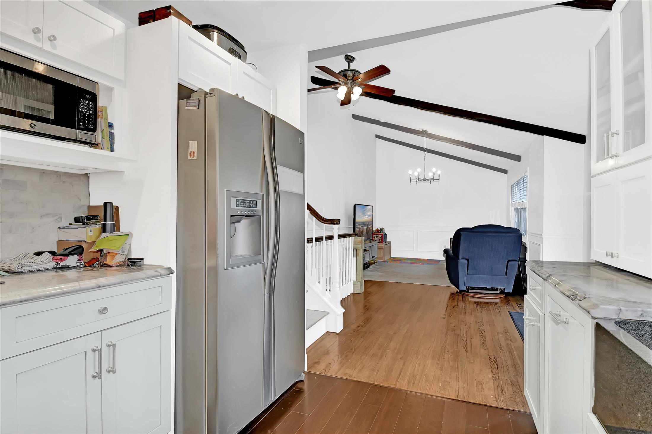675 Harmony Road Middletown, NJ 07748 - Photo 6 of 25 a kitchen with stainless steel appliances granite countertop a refrigerator and a stove top oven
