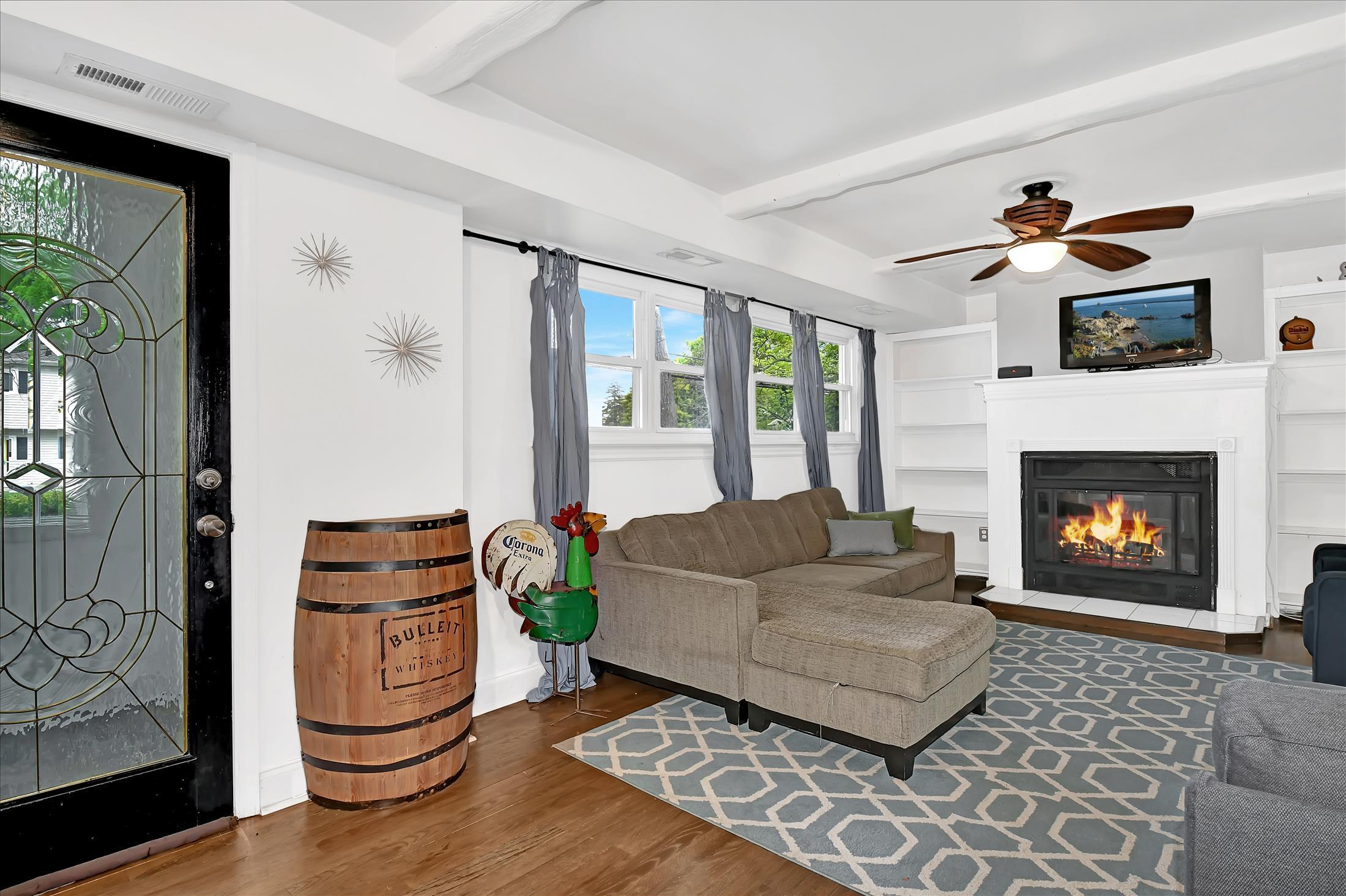 675 Harmony Road Middletown, NJ 07748 - Photo 7 of 25 a living room with furniture and a fireplace