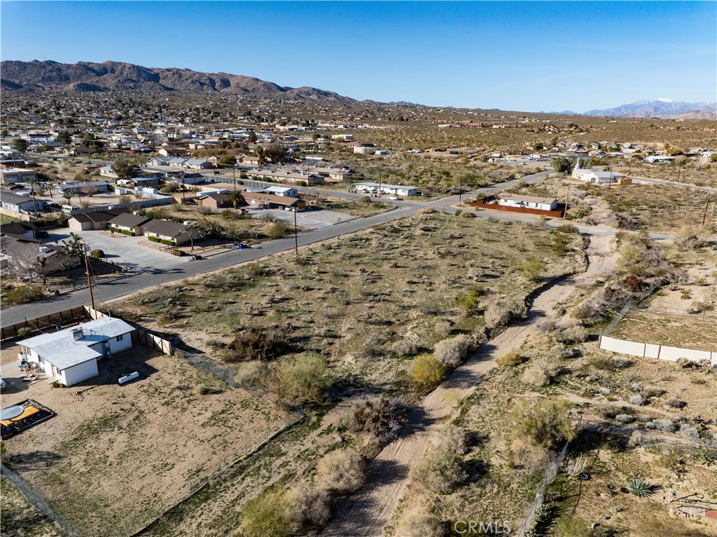 61954 Plaza Road Joshua Tree, CA 92252 - Photo 5 of 23 an aerial view of residential houses with outdoor space