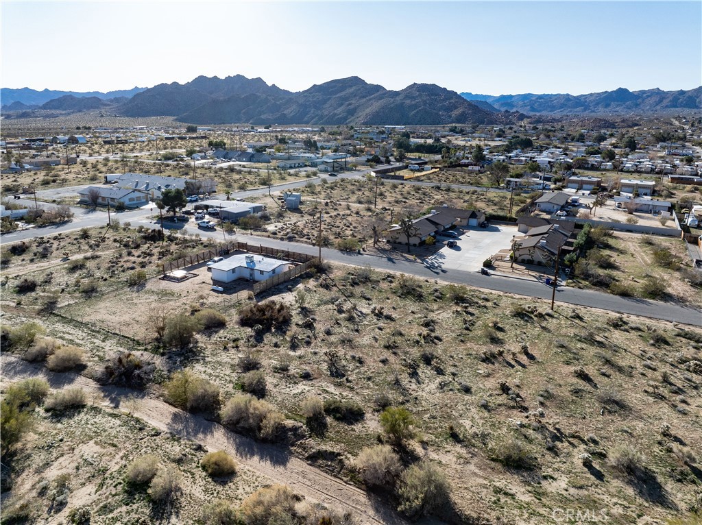 61954 Plaza Road Joshua Tree, CA 92252 - Photo 7 of 23 a view of a large mountain with lots of trees in the background