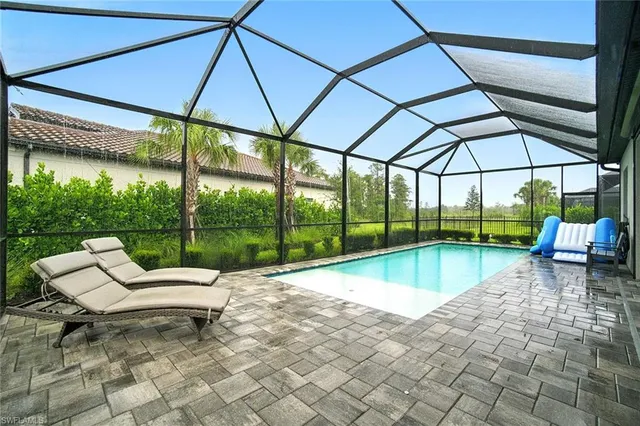 a view of a swimming pool with a patio