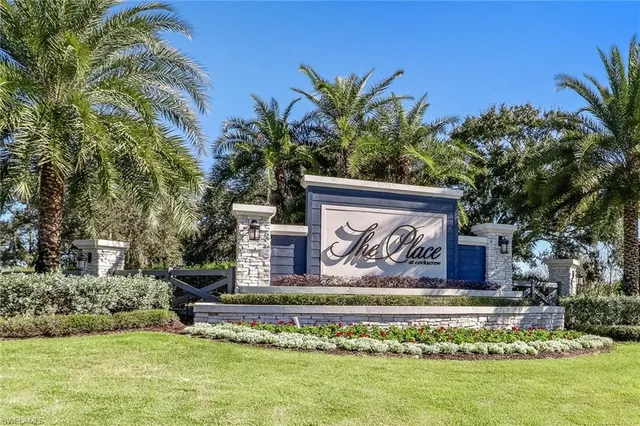 a front view of house with yard and swimming pool