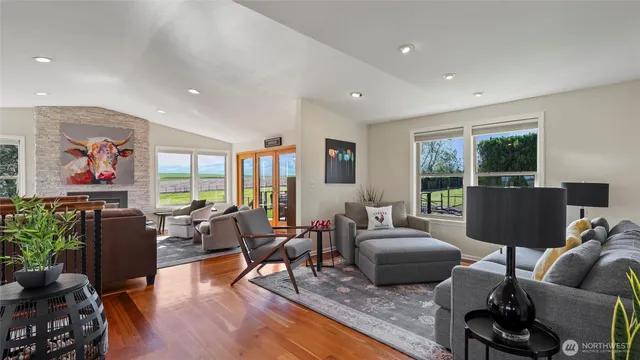 a dining room with furniture a window and a chandelier