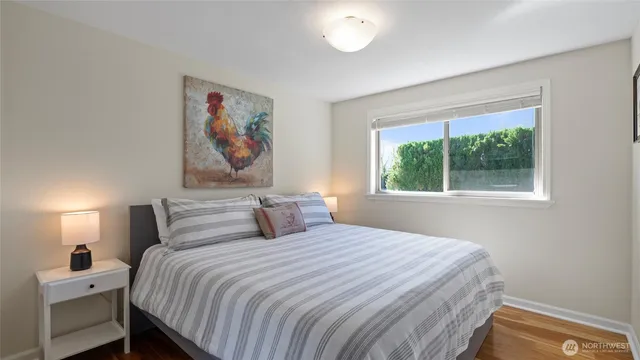 a bathroom with a granite countertop toilet a sink and a mirror