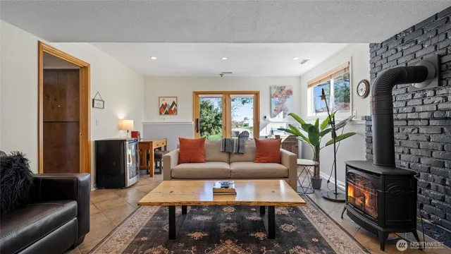 a bedroom with a bed and painting on the wall