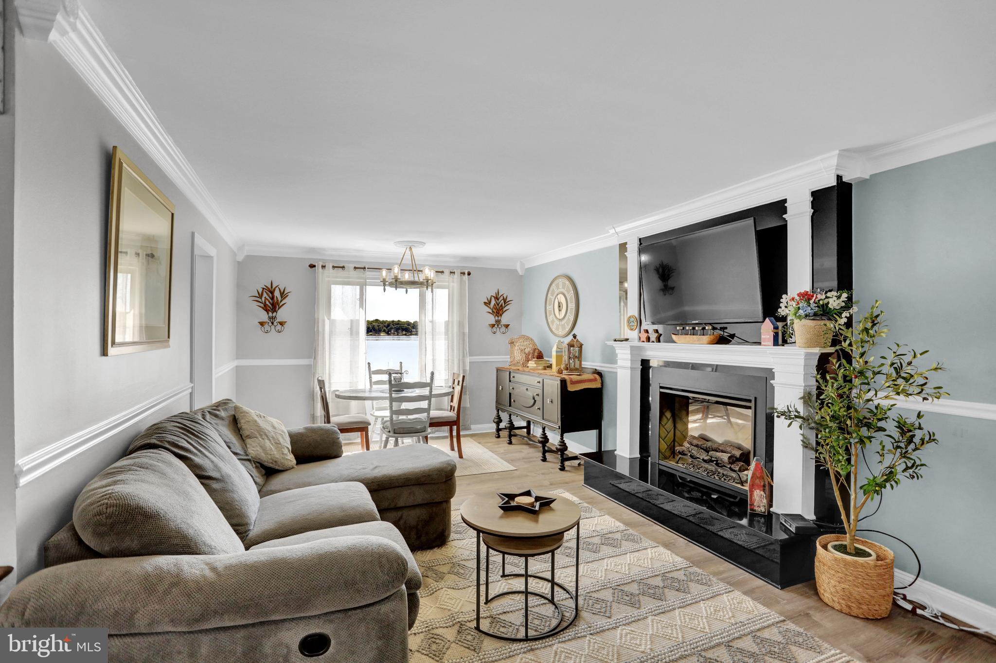 4017 East Baker Avenue Abingdon, MD 21009 - Photo 12 of 86 a living room with furniture a flat screen tv and a fireplace