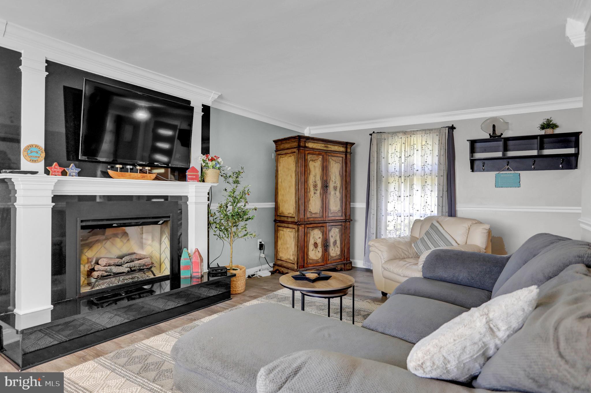 4017 East Baker Avenue Abingdon, MD 21009 - Photo 14 of 86 a living room with furniture and a fireplace