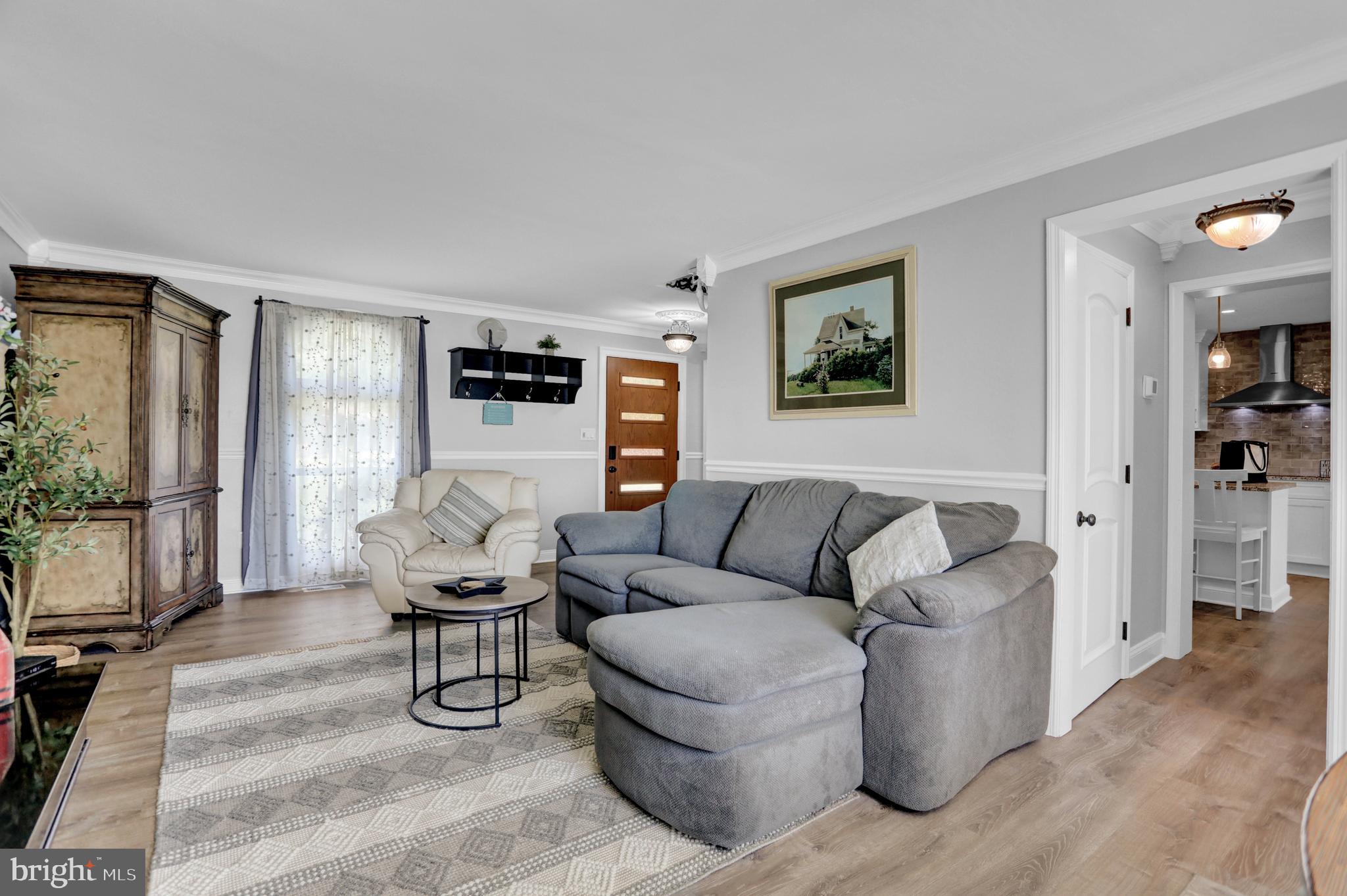 4017 East Baker Avenue Abingdon, MD 21009 - Photo 15 of 86 a living room with furniture and a flat screen tv