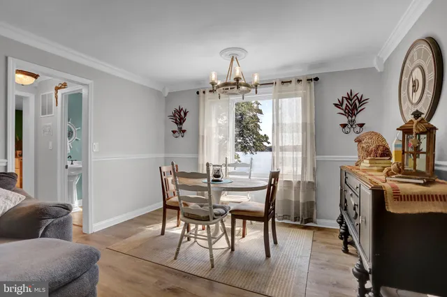 a bedroom with furniture and a flat screen tv