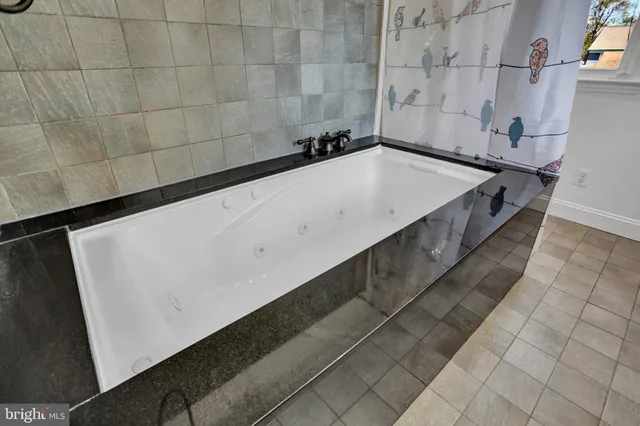 a view of a lake with a wooden deck