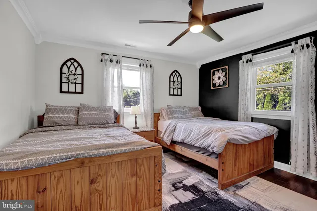 a front view of a house with a yard table and chairs