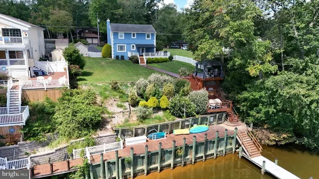 an aerial view of a house with yard swimming pool and outdoor seating