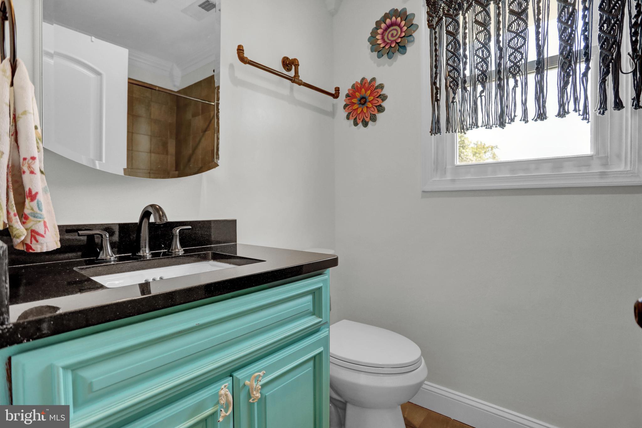 4017 East Baker Avenue Abingdon, MD 21009 - Photo 32 of 86 a bathroom with a granite countertop sink and a mirror