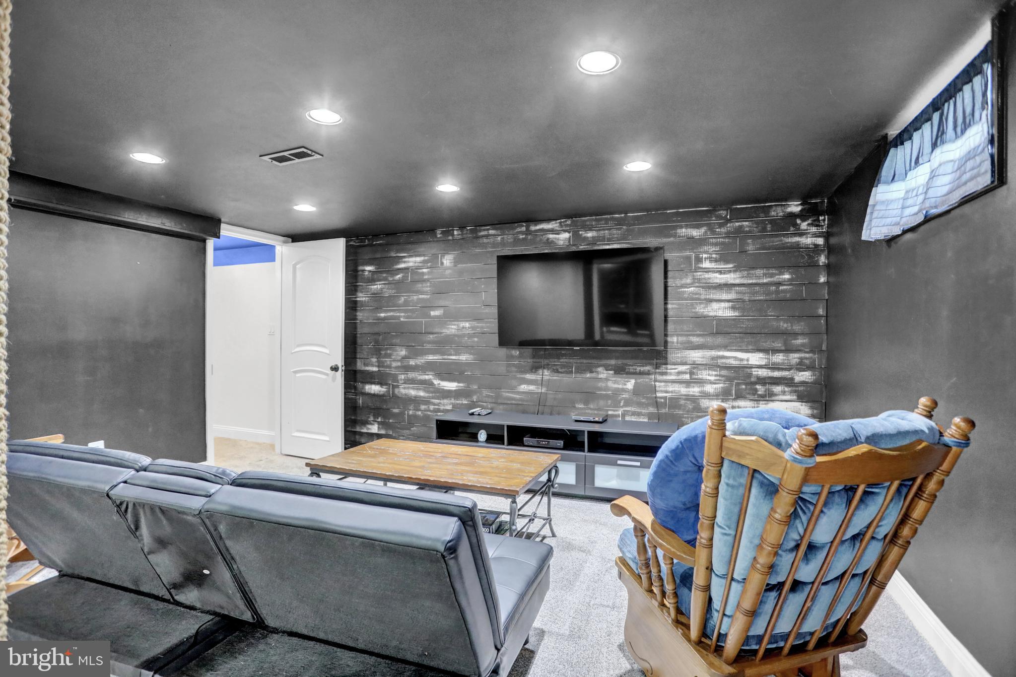 4017 East Baker Avenue Abingdon, MD 21009 - Photo 35 of 86 a view of a livingroom with furniture and a flat screen tv