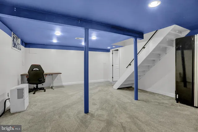 an aerial view of a house with a garden