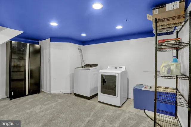 an aerial view of a house with swimming pool and outdoor space