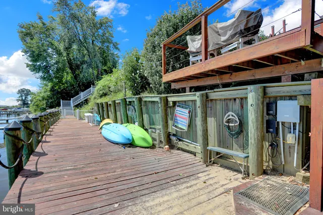 a terrace with outdoor seating and lake view