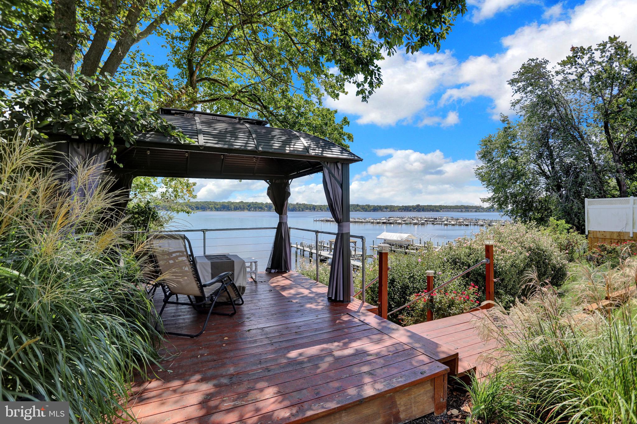 4017 East Baker Avenue Abingdon, MD 21009 - Photo 5 of 86 a view of a patio with table and chairs under an umbrella