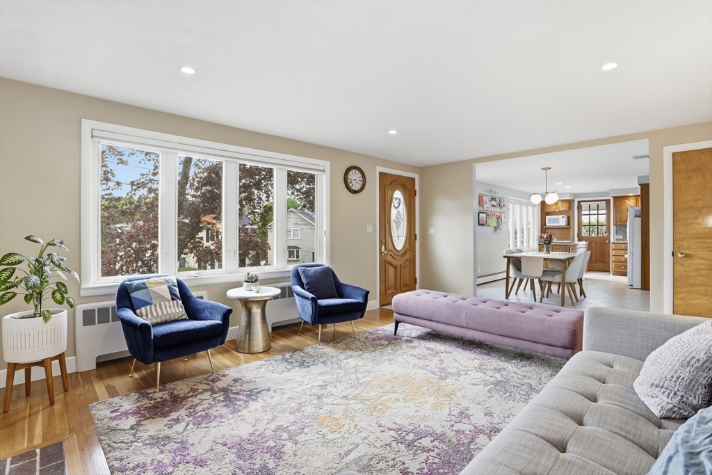 115 Collincote Street Stoneham, MA 02180 - Photo 5 of 25 a living room with furniture and a large window