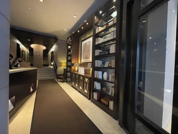 a lobby with furniture and book shelf