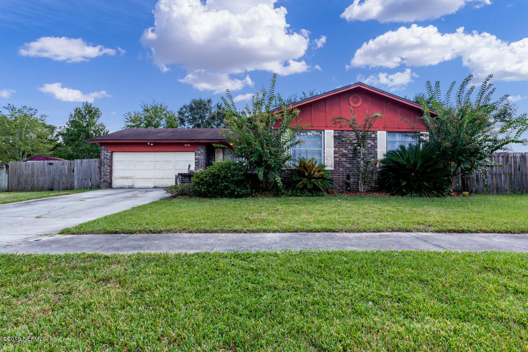 8759 Moss Haven Road Jacksonville, FL 32221 - Photo 1 of 29 a view of a yard in front of a house with a yard