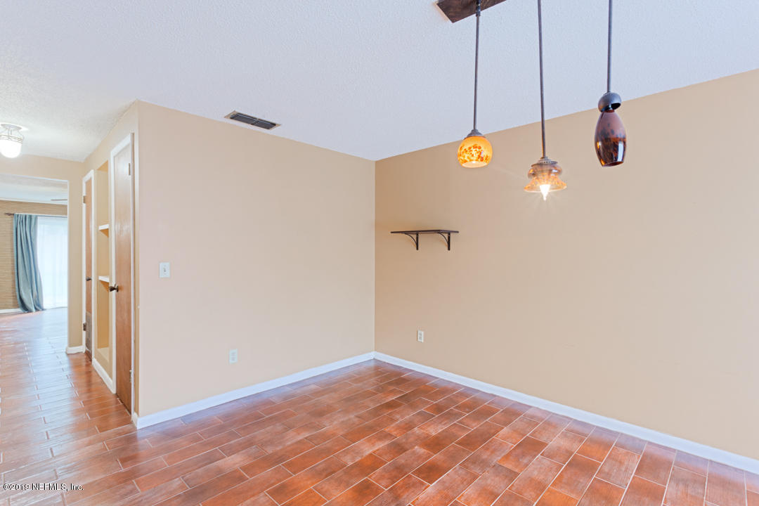 8759 Moss Haven Road Jacksonville, FL 32221 - Photo 15 of 29 a view of a room with wooden floor