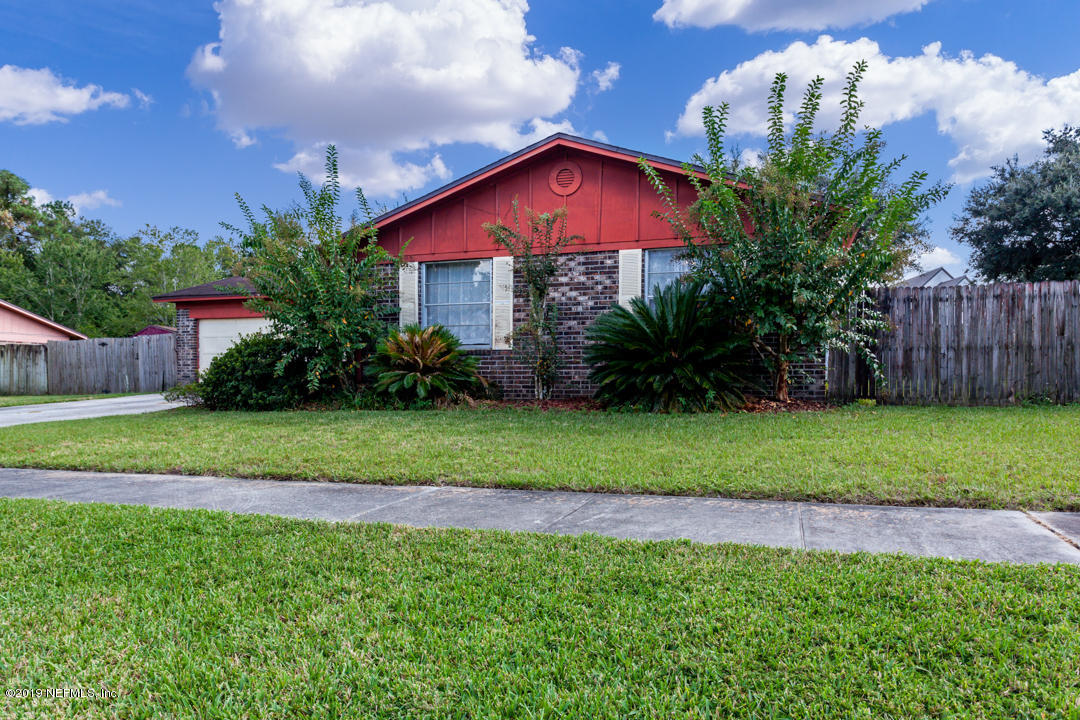 8759 Moss Haven Road Jacksonville, FL 32221 - Photo 2 of 29 a view of a house with a yard and a garden
