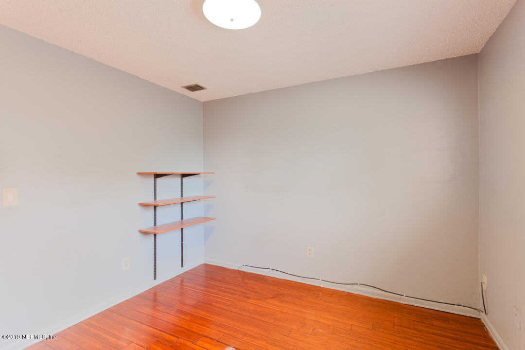8759 Moss Haven Road Jacksonville, FL 32221 - Photo 25 of 29 a view of a room with wooden floor