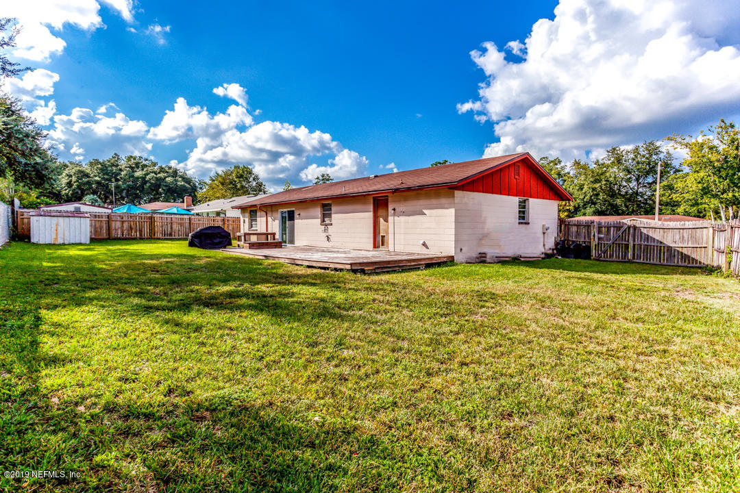 8759 Moss Haven Road Jacksonville, FL 32221 - Photo 29 of 29 a view of a house with a yard porch and sitting area