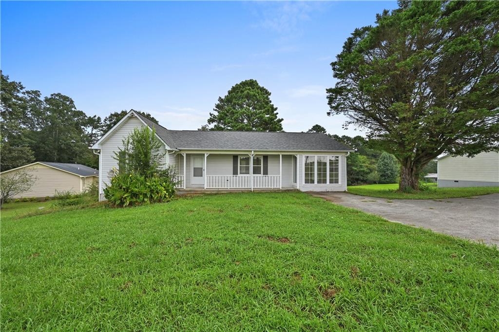 254 Gravely Road Southeast Calhoun, GA 30701 - Photo 1 of 1 a front view of a house with a garden