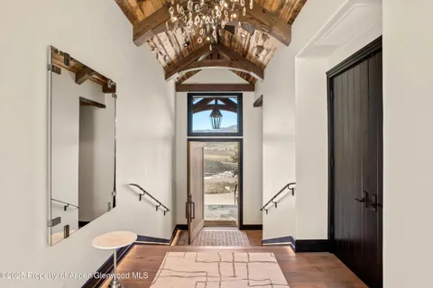 a living room with a furniture and a rug