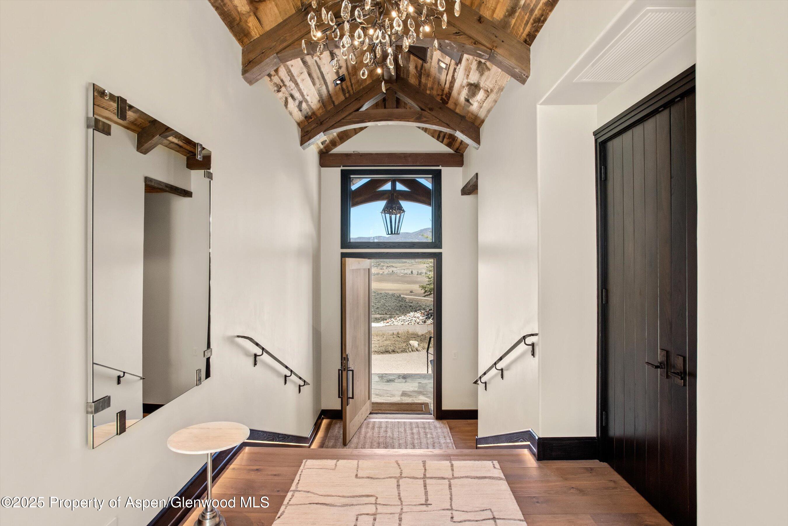 2318 Lazy O Road Snowmass, CO 81654 - Photo 3 of 50 a living room with a furniture and a rug