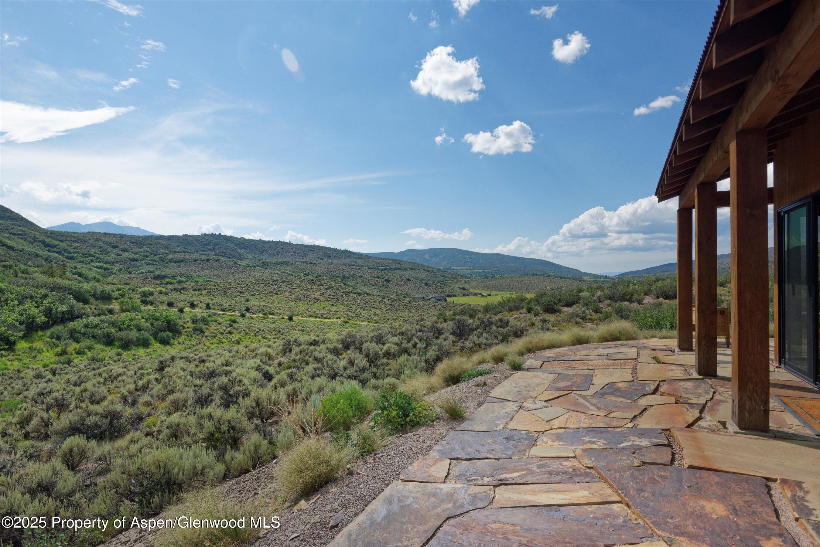 2318 Lazy O Road Snowmass, CO 81654 - Photo 46 of 50 a view of a city with lush green forest