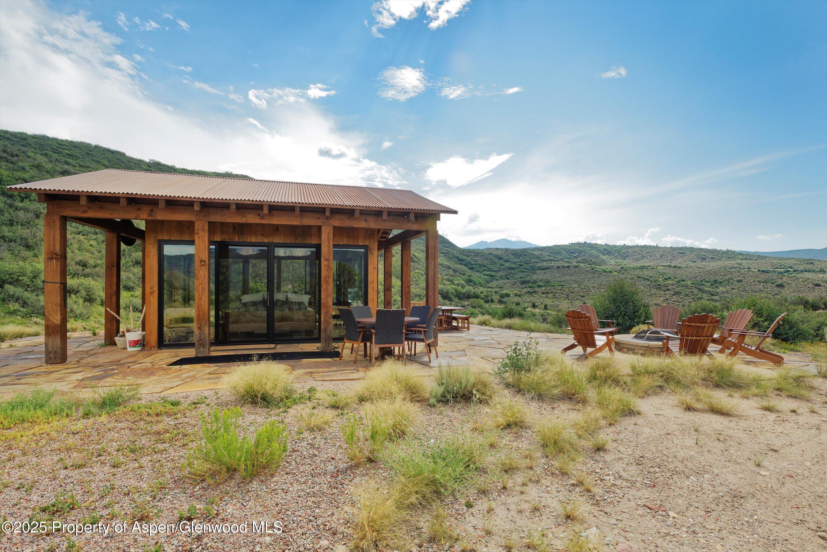 2318 Lazy O Road Snowmass, CO 81654 - Photo 47 of 50 a view of a house with yard and sitting area