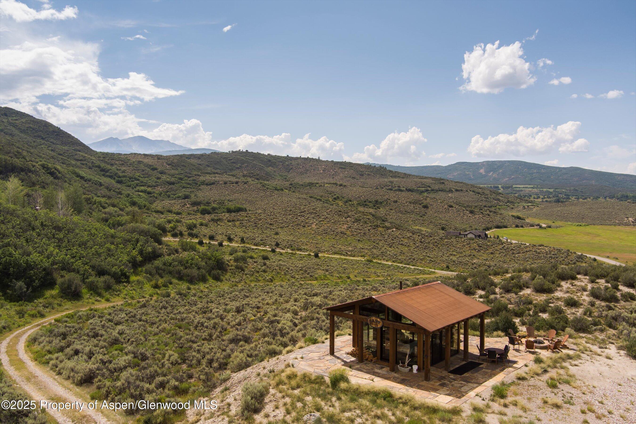 2318 Lazy O Road Snowmass, CO 81654 - Photo 48 of 50 a view of a terrace with a lake view