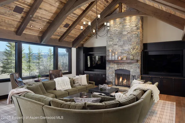 a living room with furniture fireplace and a flat screen tv